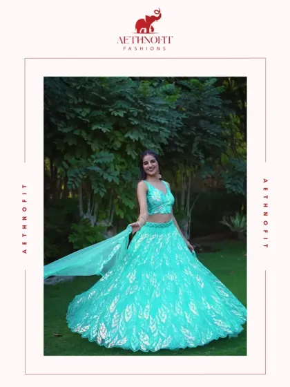 If mermaids had a wardrobe, this would be in it. This aqua georgette lehenga flows like ocean waves, with intricate leaf embroidery for a touch of nature's elegance.