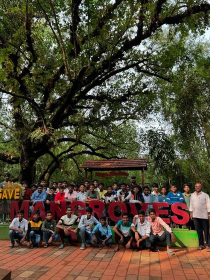 Students at the "Save Mangroves" park, an important stop on our educational coastal tour. I believe in promoting environmental awareness through travel.
