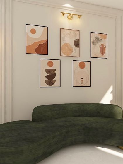 A statement piece for your living room. This curved green sofa, paired with a gallery wall and elegant lighting, creates a stunning focal point.