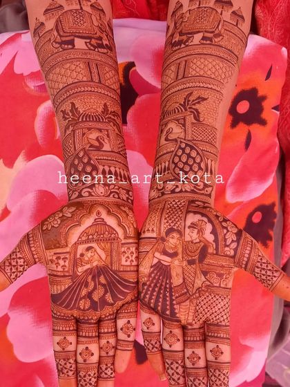 A classic bridal design with portraits of the couple on the palms and royal elephants on the arms.