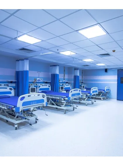 The post-operative recovery area within the Memorial Hospital. The layout is designed for staff efficiency and patient monitoring, with clean, durable materials and a calming blue color scheme.