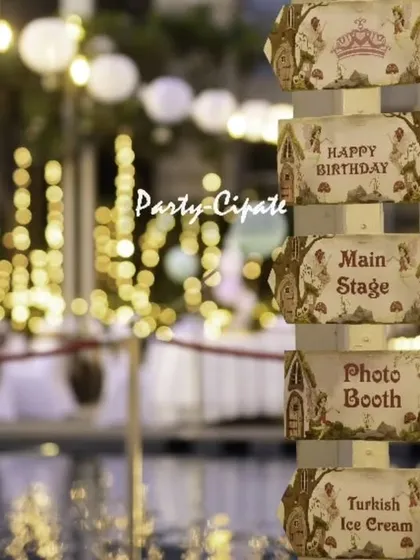 The little details make an event truly personal. For this enchanted forest themed birthday party, we created a custom wooden signpost to guide guests to the main stage and photo booth. Set against the poolside with twinkling lights, it added a touch of whimsy and practicality to the celebration.