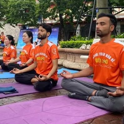 My instructors leading a meditation session in Vietnam, demonstrating the global presence and teaching quality of the SKM Yoga team.