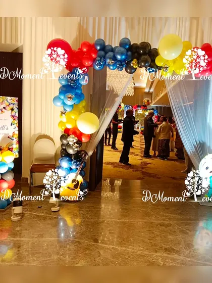 The entrance to the musical-themed party, featuring a colorful balloon arch and a welcome sign for guests.