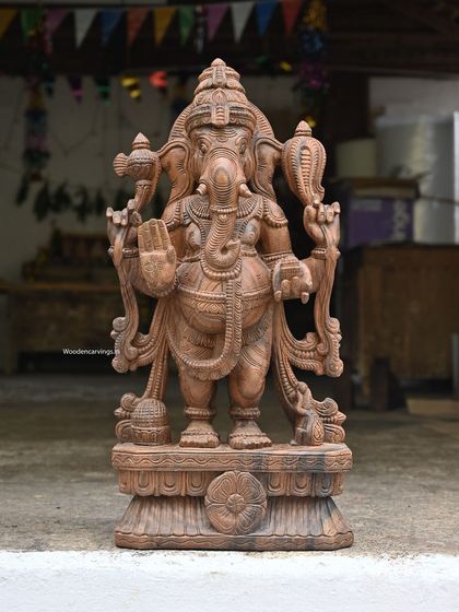 A 31-inch standing Ganesha in the blessing pose (Abhaya mudra). Accompanied by his vahana, this statue has a commanding yet gentle presence, ideal for a home or office entrance.