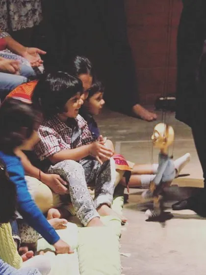 A young audience member completely absorbed in the performance. These are the quiet, magical moments we cherish.