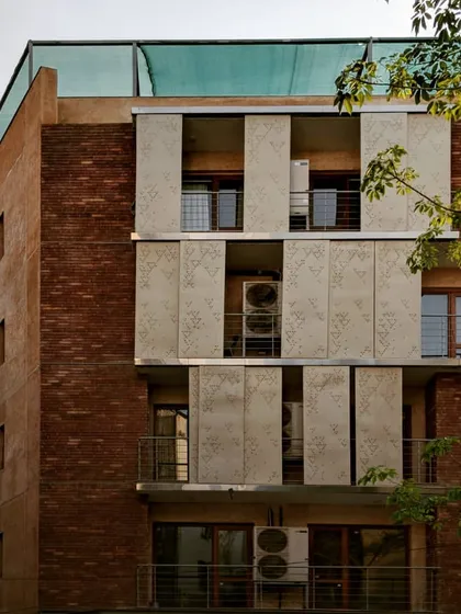 We blend traditional wisdom with modern solutions. For this home in Defence Colony, we designed these movable, perforated metal screens. They function like a modern jaali, blocking the harsh sun while allowing diffused light and air to pass through, keeping the home cool and reducing energy consumption.