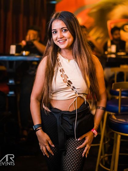 A stylish guest posing at the bar.