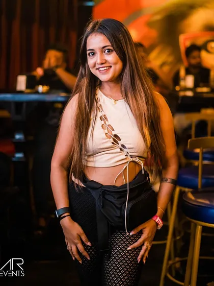 A stylish guest posing at the bar.