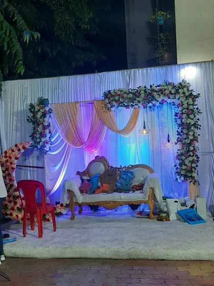 A candid shot of the engagement stage setup before the event begins, showing the soft lighting and decor in a quiet moment.