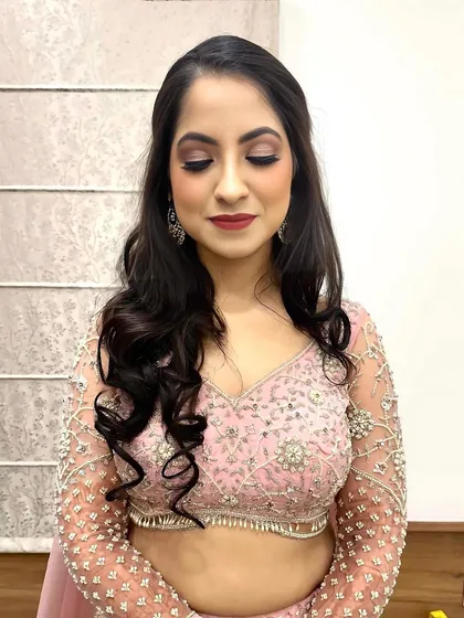 A beautiful cocktail look in a soft pink lehenga. I created a shimmery eye and a bold lip to complete this party-ready style.