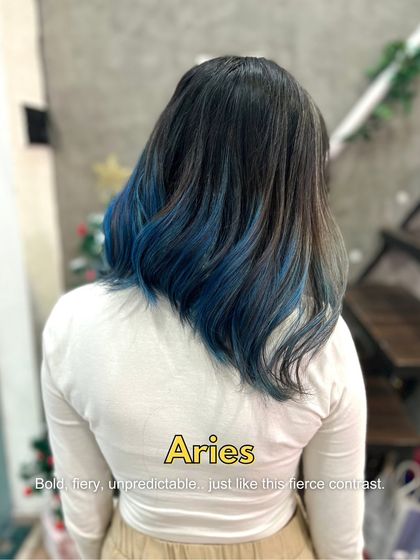 For the fiery and unpredictable Aries, this bold blue contrast is a perfect match. It's a fierce look that makes a statement.