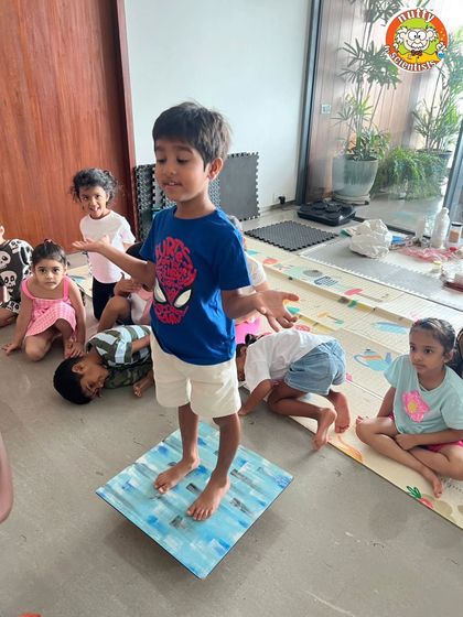 Success! This young scientist is balancing perfectly, proving that with the right design, simple materials can be incredibly strong. A great confidence booster.