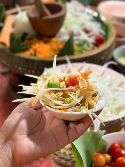 A perfectly balanced bowl of Thai Green Papaya Salad. The crunch of the peanuts and the freshness of the papaya make this a perfect start to any meal.