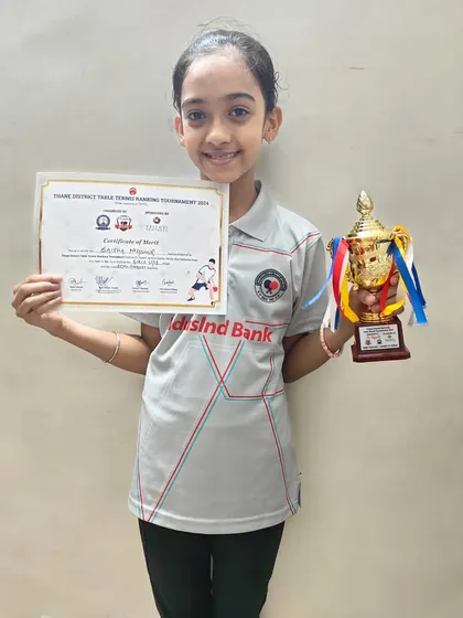 Saisha P. Madhur holds her trophy and certificate after securing third place in the U-11 girls' category at the 1st District Ranking Tournament.