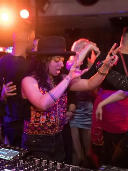 A guest DJ enjoying the vibe from behind the decks. I love having friends join me to spin their favorite tracks.