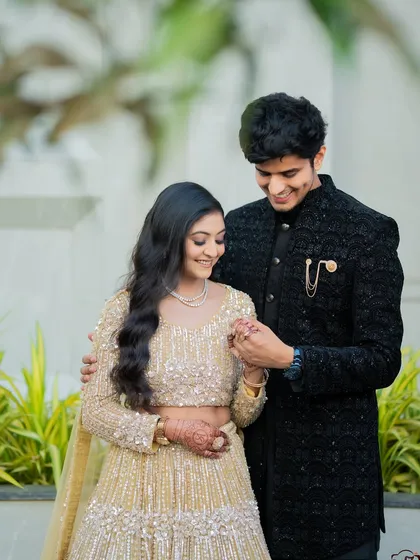 A close-up of Apoorv and Shikha's hands, focusing on the ring and their gentle interaction. It’s a simple yet powerful shot.