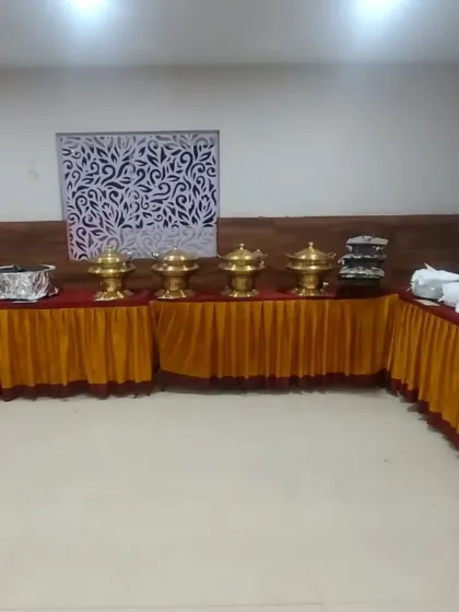 A straightforward buffet setup with our classic brass serving dishes, suitable for any type of indoor event or family function.