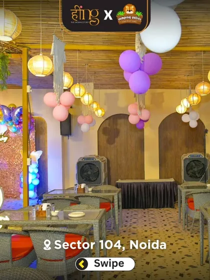 Another view of the butterfly-themed party setup, showing the coordinated purple and pink balloons and the elegant dining arrangement.