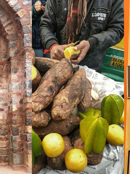 A street vendor in Delhi peeling and selling sweet potatoes and starfruit.