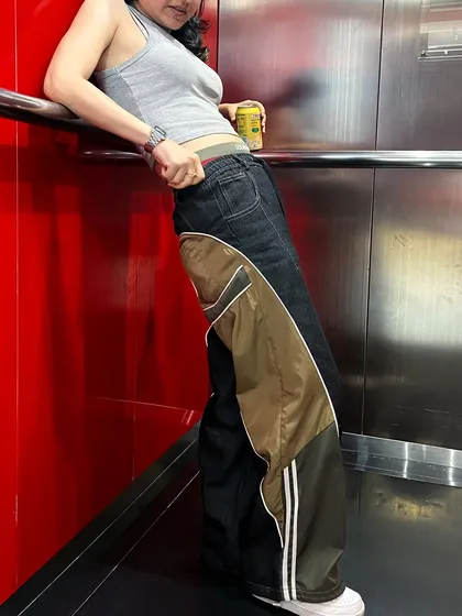 Here's a look at my custom unisex pants, designed with a wide-leg silhouette. I combined dark denim with contrasting nylon panels and athletic stripes to create a unique streetwear staple.