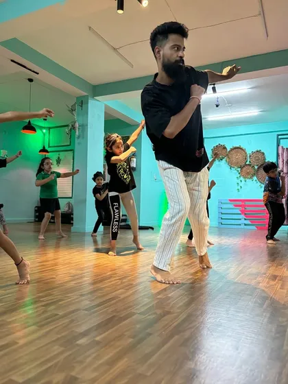 Our instructor, Anand, leading the Powerpuff Intermediate class. He brings incredible energy and precision to his teaching, inspiring the students to push themselves.