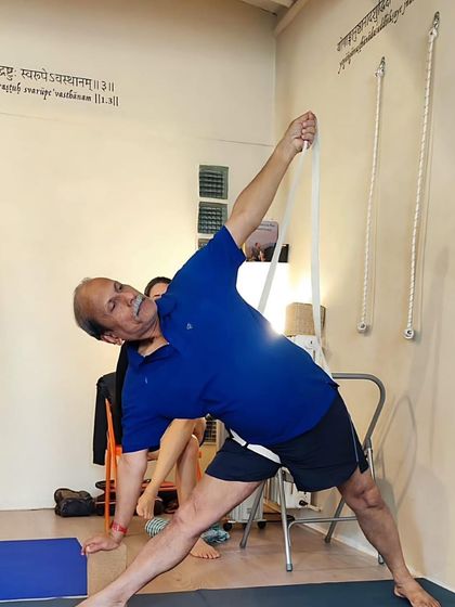 At Yoga Shala Arles in the South of France, demonstrating Utthita Trikonasana with the help of a wall rope to enhance the extension of the spine.