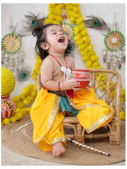 The pure joy of our Janmashtami theme shoot. We love capturing these energetic and happy moments as your little one celebrates, dressed as the playful Lord Krishna.