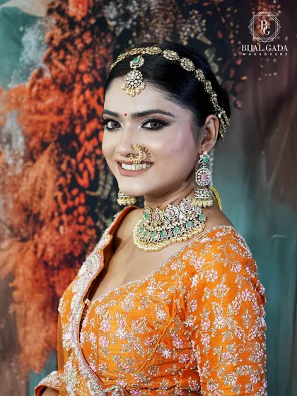 A bright and cheerful portrait of the bride. Her smile lights up her face, and the makeup is designed to look fresh and radiant, perfect for a day wedding.