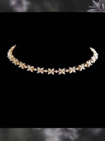 A delicate and budget-friendly diamond necklace with a floral-inspired design. This piece offers the look of real diamonds in a light, wearable, and affordable style.
