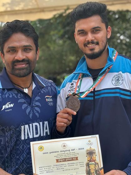 Posing with a fellow coach and my bronze medal. The boxing community in Karnataka is strong, and we are proud to be a part of it.