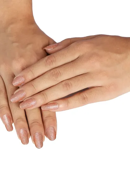 A model's hands showing the applied glitter nail polish. This on-model shot for e-commerce helps customers see the final look and color on a real person.