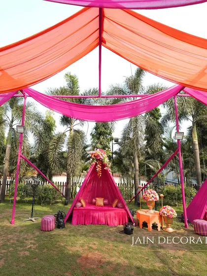 More cozy seating areas for guests. These tented nooks provide a comfortable and stylish space for guests to mingle and enjoy the festivities.