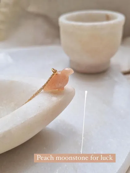 My 'dóve' pendant, carved from peach moonstone. The dove is a symbol of peace and calm, and this stone attracts abundance and good fortune in love.