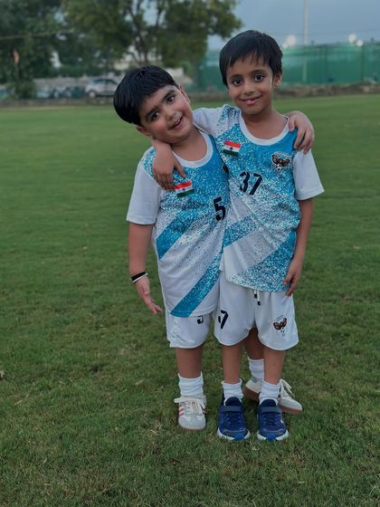 Brothers in arms. Two of our youngest players, who are also brothers, share a moment on the training ground.