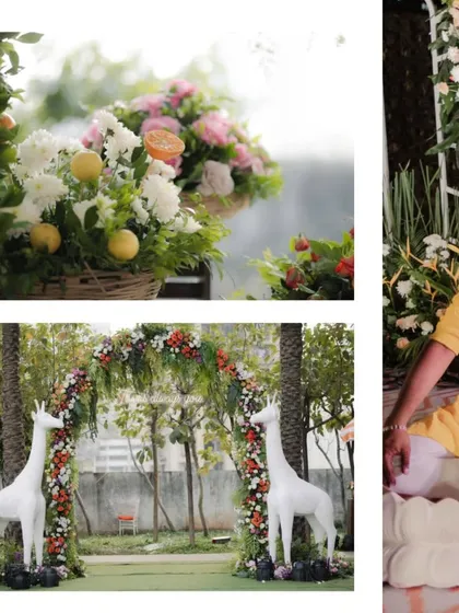 A whimsical Haldi decor setup featuring floral arches with citrus fruit accents and adorable white giraffe statues. We love coming up with unique decor themes.