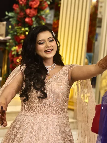 A candid shot of the engagement bride dancing and enjoying her night. The makeup is designed to be long-lasting and photo-ready, even during high-energy celebrations.