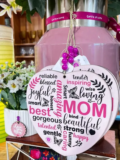 A heart-shaped wooden plaque for Mom, listing all the wonderful things she is. A perfect Mother's Day gift.