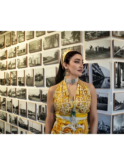 This profile shot highlights the complete look, including the matching printed headband. The entire ensemble was curated to feel like a piece of wearable art, perfect for a feature on art and style.