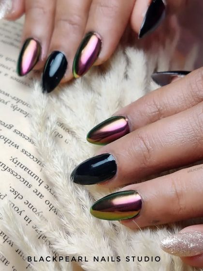 A luxurious design combining chameleon chrome with sleek black nails. The chrome nails shift from green to purple, creating a stunning contrast against the glossy black for a truly glamorous look.