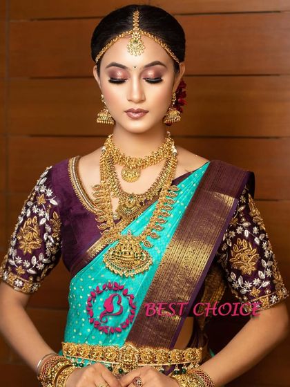 A beautiful portrait showing the intricate details of the Lakshmi pendant on the long haram.