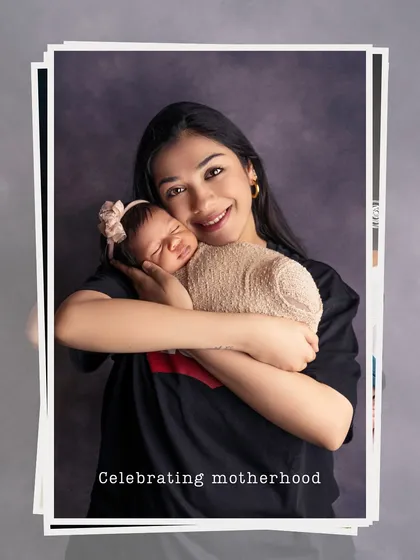 A happy, smiling mother cherishing a cuddle with her newborn. These are the moments of pure joy that I love to capture.