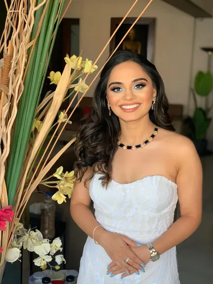 I love bringing a theme to life through makeup. For Priyanka's Greece-themed engagement party, we went with a fresh, sun-kissed look with shimmering eyes, paired with her beautiful white strapless dress.