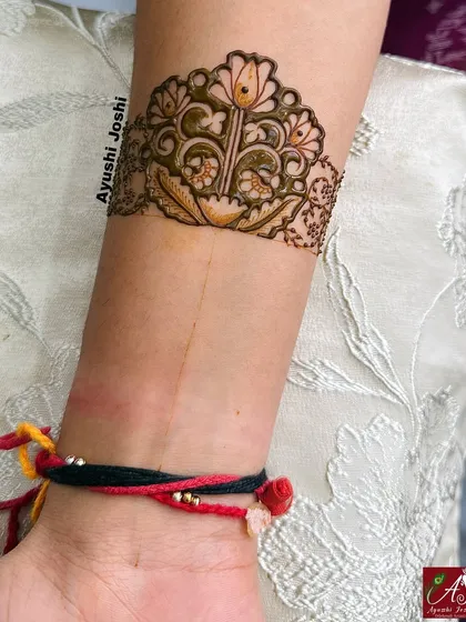The 'tapasvi' floral design in its initial stages, highlighting the beauty of the simple outline.