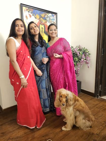 Posto posing with the ladies of the house during the baby shower festivities.