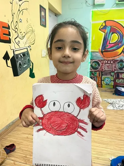 This adorable crab drawing was a highlight of our art session. I teach simple shapes and techniques so even the youngest kids can create something they're proud of.