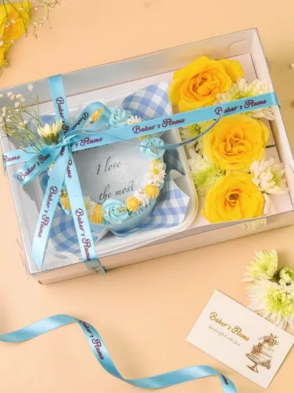 A bakery hamper with a branded ribbon and business card, a great shot for corporate branding.