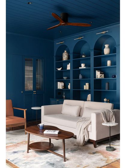 The color-drenched library at our Tinted Tapestries project, showcasing the floor-to-ceiling custom joinery. The repetition of the arches in the shelving creates a beautiful rhythm and sense of grandeur in the space.