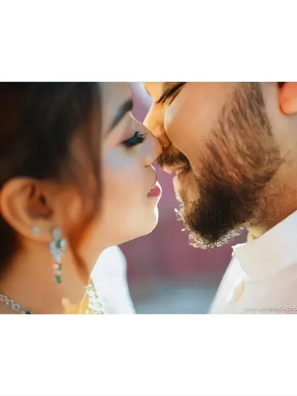 An extreme close-up capturing the moment just before a kiss. This intimate and artistic shot focuses on the emotion and anticipation, creating a powerful and romantic image.