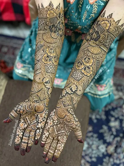 A complete bridal look for bride Sana. This design shows how I balance intricate patterns on both hands and arms, ensuring they are symmetrical yet each have their own unique details.